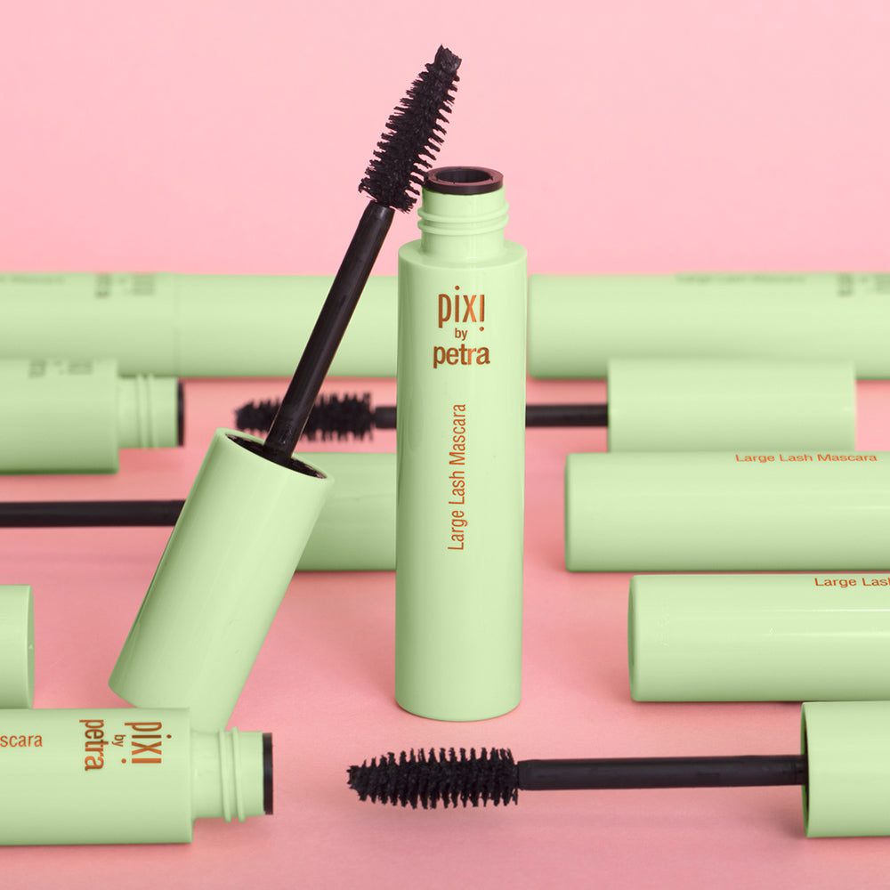 Large Lash Mascara in multiple bottles on a pink background