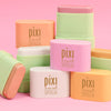 On-the-Glow SUPERGLOW Petites shown on a pink background displaying all shades