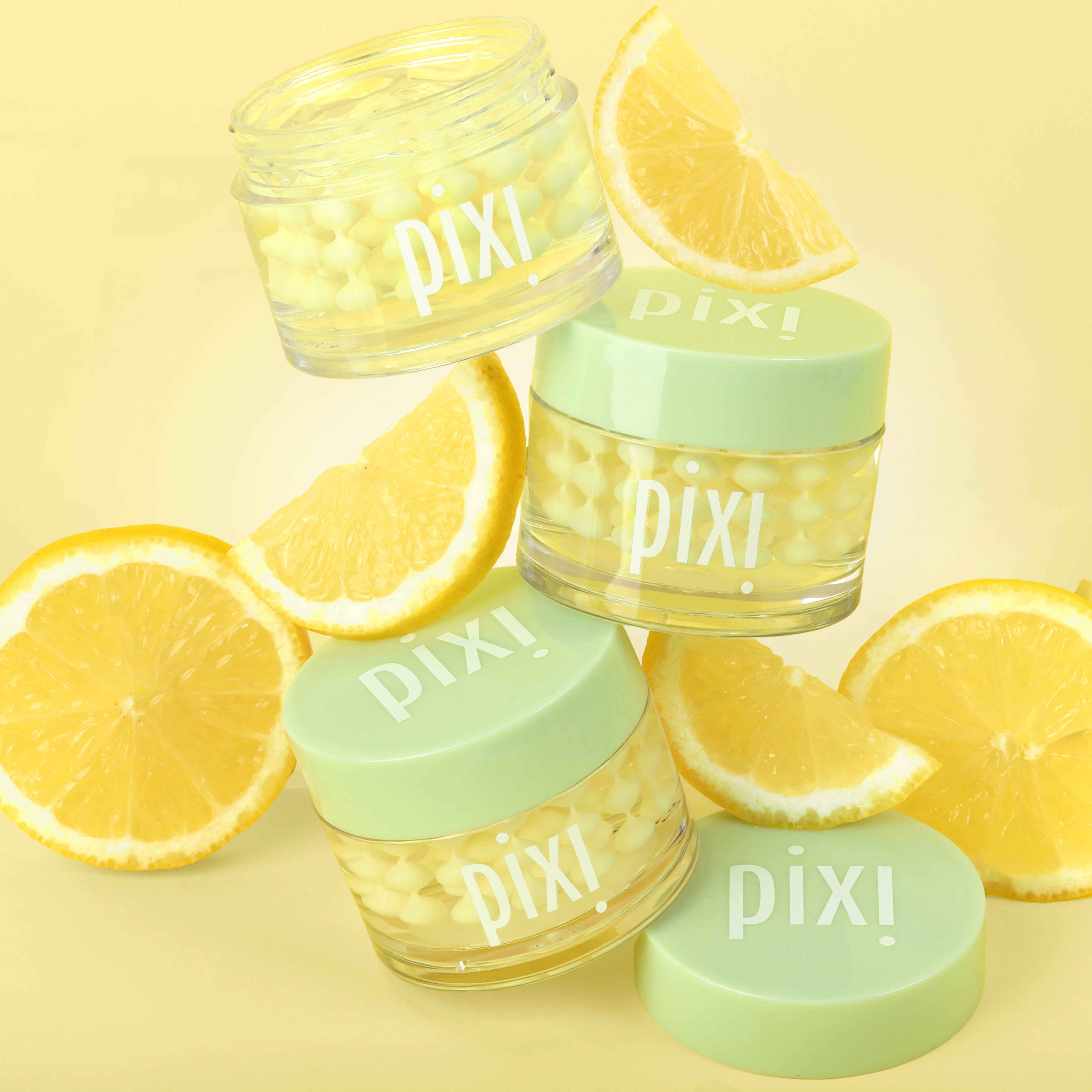 Vitamin-C CremeSerum with lemon slices on a yellow background